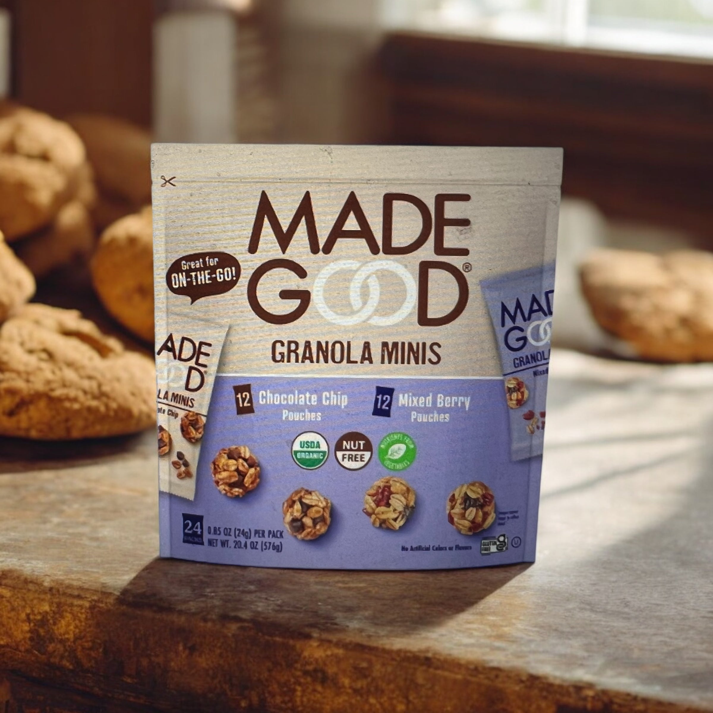 A package of Easy Lunches' MadeGood Granola Minis, Variety Pack - 24 count, featuring chocolate chip and mixed berry flavors. The package emphasizes that it is a healthy snack, perfect for on-the-go consumption, and allergen-free.