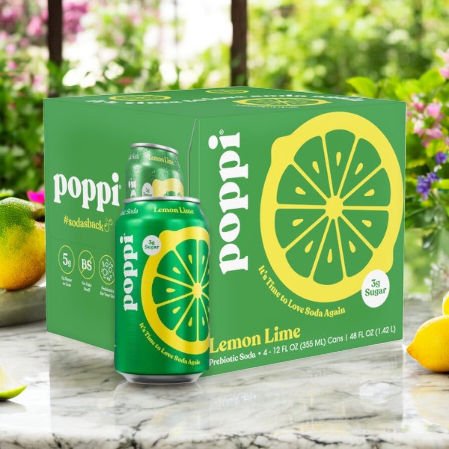 A Poppi Prebiotic Soda, Lemon Lime 12-pack, rests elegantly on a marble surface with a vibrant Lemon Lime can in front and surrounded by fresh citrus. Infused with gut-friendly prebiotics, this drink is refreshing and nourishing.