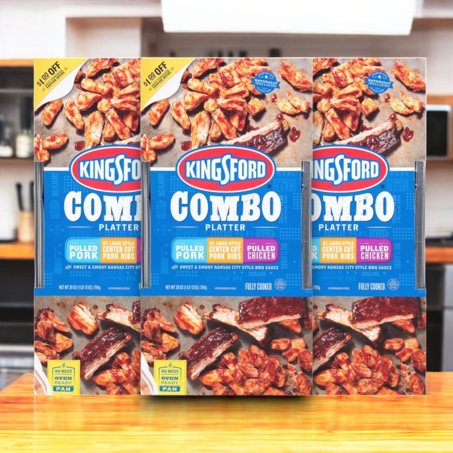 Three 28 oz boxes of Kingsford Combo Platter, featuring pulled pork, St. Louis Style Center Cut Pork Ribs, and pulled chicken, elegantly displayed on a kitchen counter.