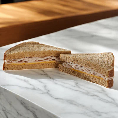 The E.A. Sween Sandwich Combo offers a premium turkey sandwich on wheat bread, cut diagonally for easy grab-and-go options, perfect when you're seeking convenience and variety. Ships frozen with a 30-day shelf life once thawed!.
