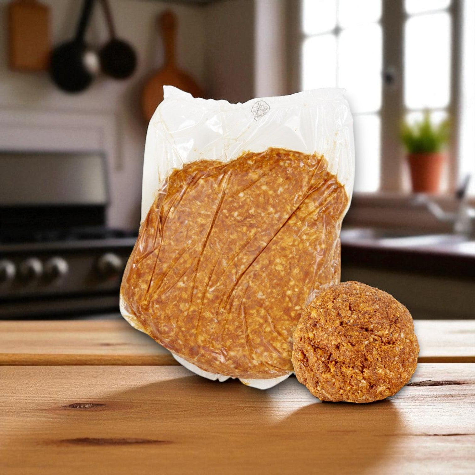 A sealed Sysco Fontanini Raw Chorizo Pork Sausage bag is placed beside a shaped portion of the same bulk uncooked sausage on a wooden kitchen surface. Product: 20 lbs (4 packs of 5 lbs).