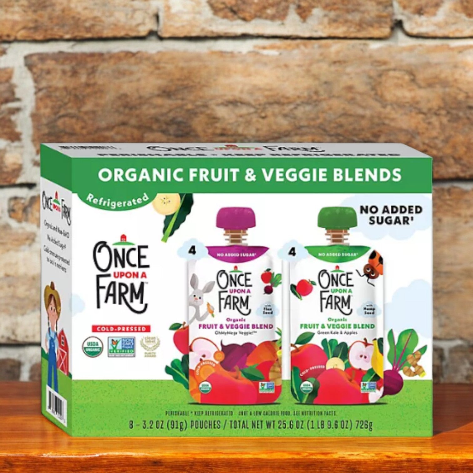 A box of Easy Lunches' Kids Lunch Bundle #1 includes 8 "Once Upon a Farm" organic fruit and veggie blends, perfect for kids' lunches. Each blend is packaged in colorful 3.2 oz pouches labeled "No Added Sugar," ensuring nutritious meals with every bite.