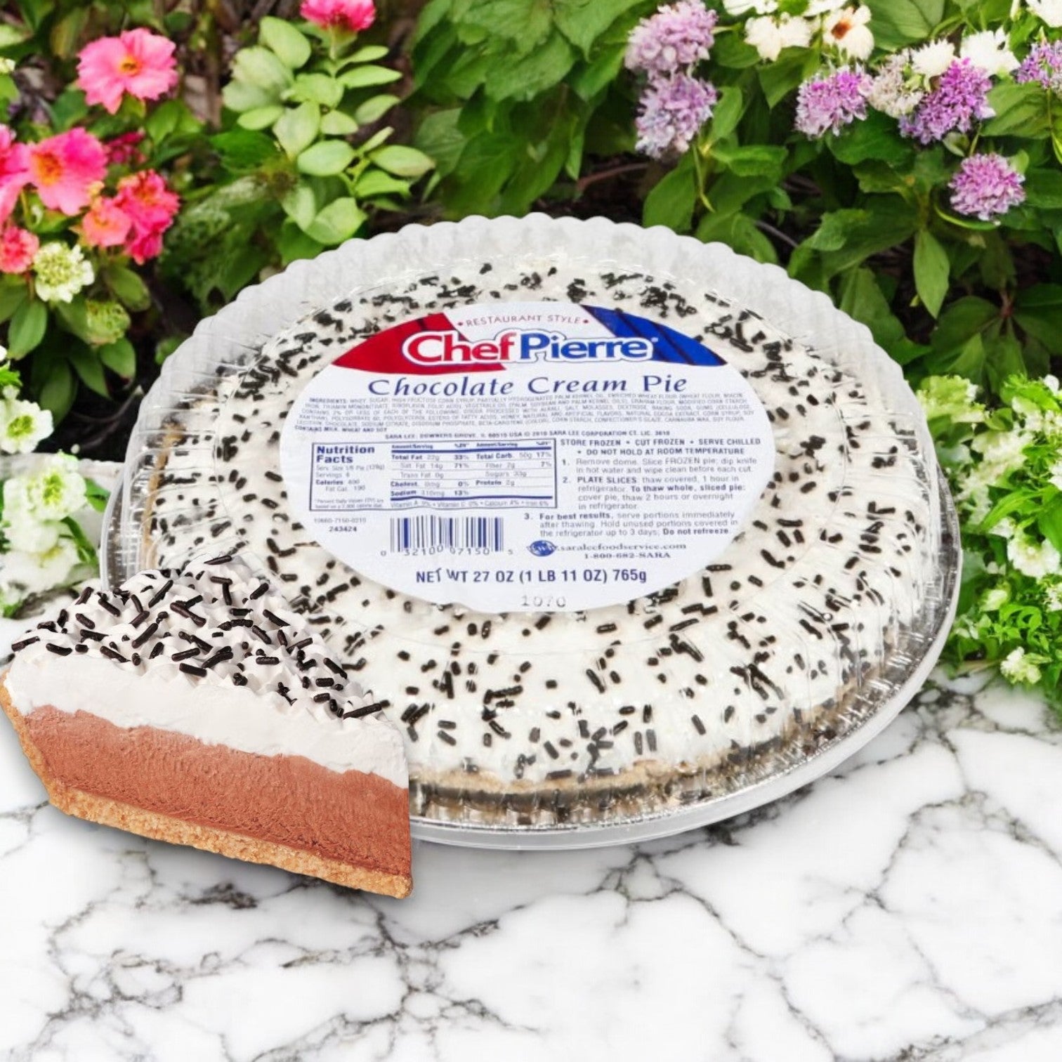 The Chef Pierre Chocolate Cream Pie is a decadent 10-inch frozen dessert adorned with lush chocolate sprinkles and presented in plastic packaging surrounded by vibrant flowers. A tempting slice beckons from the front, inviting all who see it.