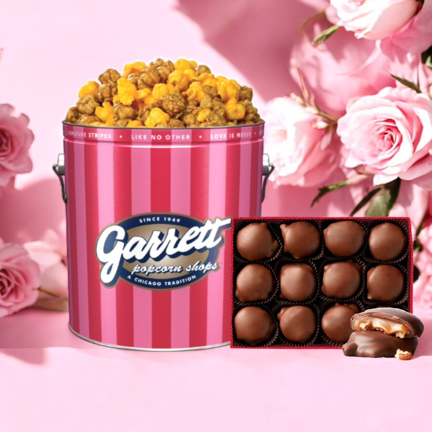 The Easy Lunches' Garrett Mix and Fannie May Pixel Combo is showcased with pink roses, offering an ideal sweet and savory delight.