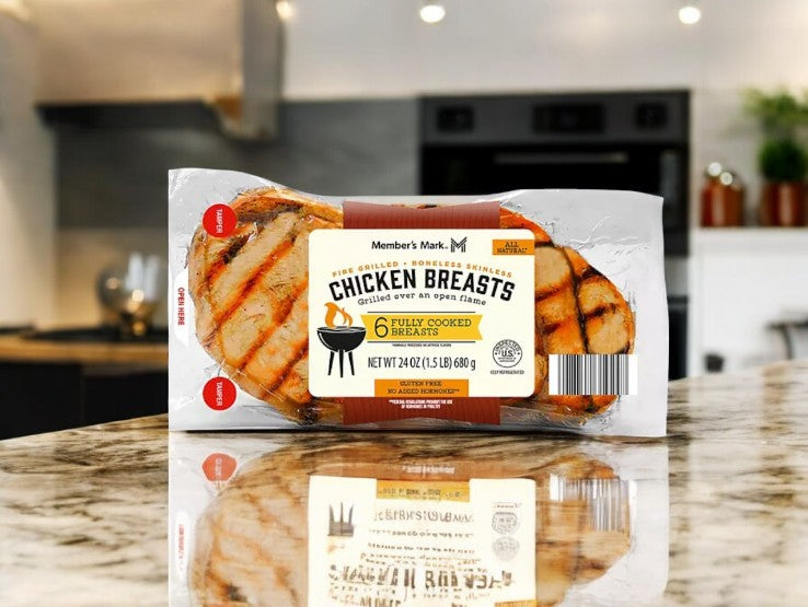 Member's Mark Fire Grilled Chicken Breasts by Easy Lunches are protein-rich and conveniently ready for busy days, resting on a marble countertop in a cozy kitchen, offering the perfect quick meal solution.