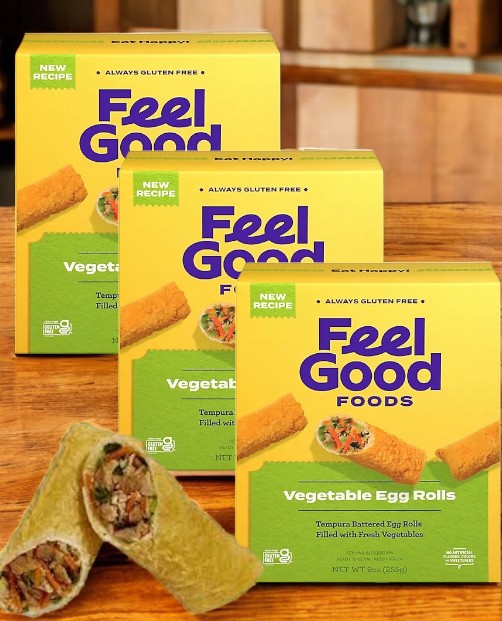 Three boxes of Feel Good Foods Gluten-Free Vegetable Egg Rolls, 9 oz-3 Count, an allergen-friendly snack with appealing images on a wooden surface, clearly marked as gluten-free.