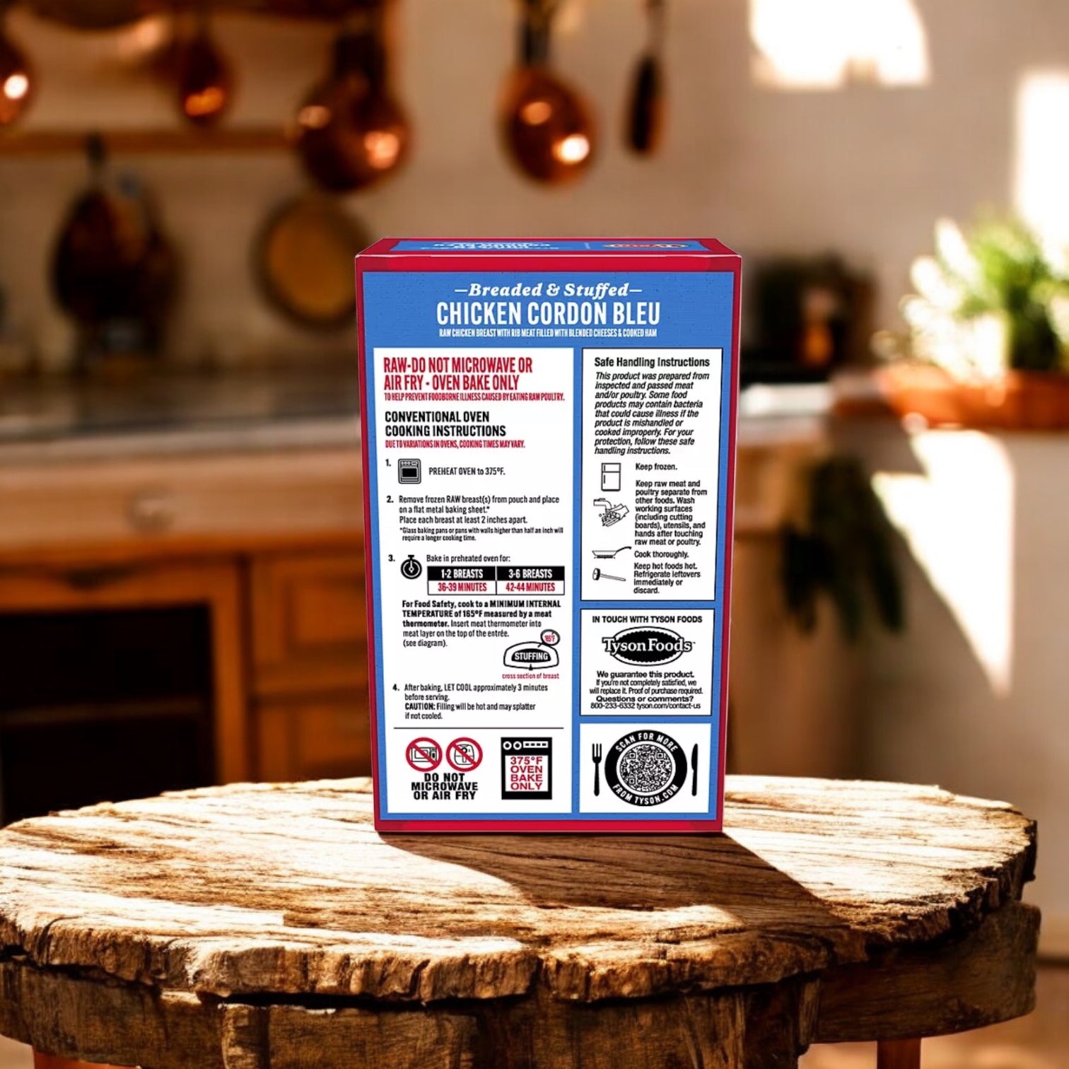 A box of Tyson Breaded Boneless Raw Stuffed Chicken Breasts with Rib Meat Cordon Bleu, Frozen, 6 oz. 3 Count sits on a wooden table with kitchen instructions visible; a blurred kitchen is in the background.