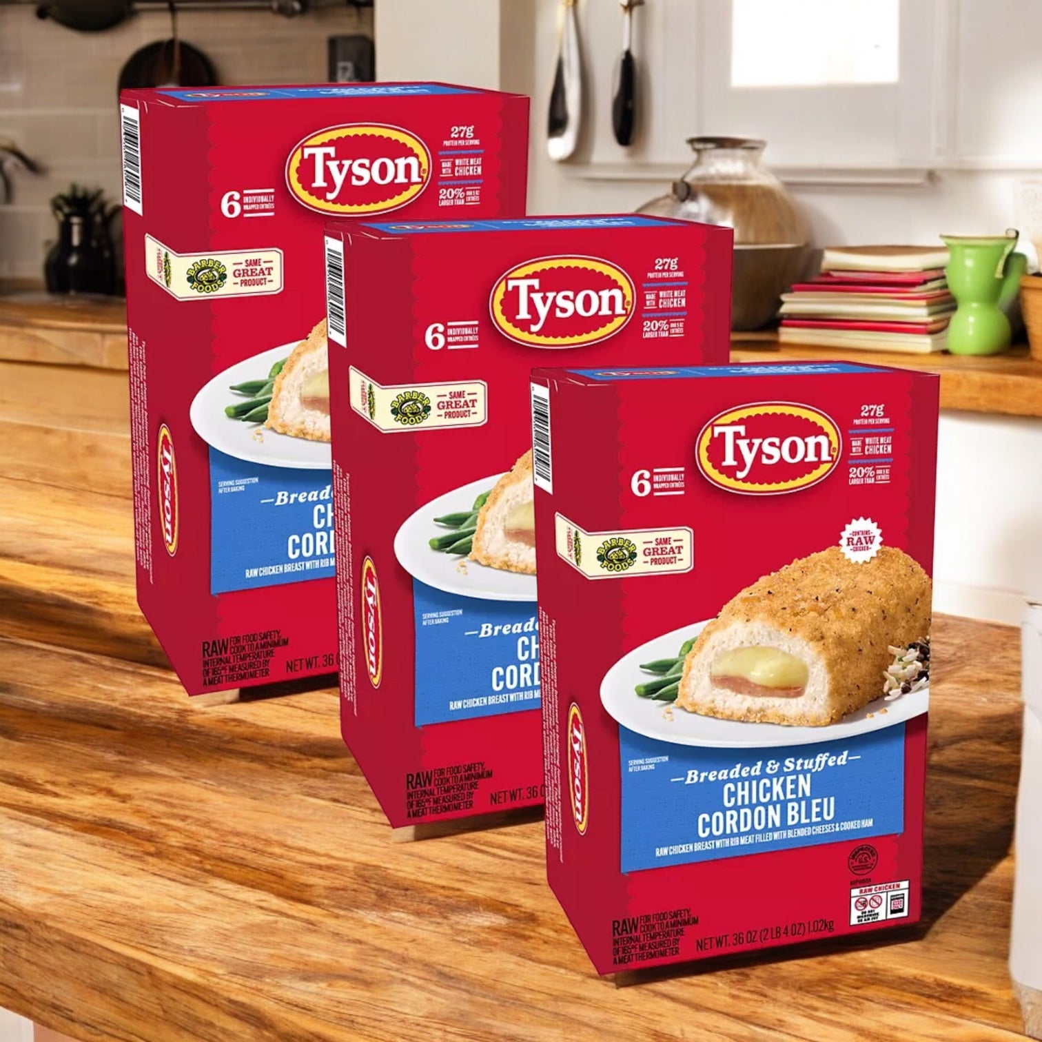 Three boxes of Tyson Breaded Boneless Raw Stuffed Chicken Breasts with Rib Meat Cordon Bleu, Frozen, 6 oz. 3 Count, are displayed on a wooden kitchen counter—delicious stuffed chicken perfect for any meal.