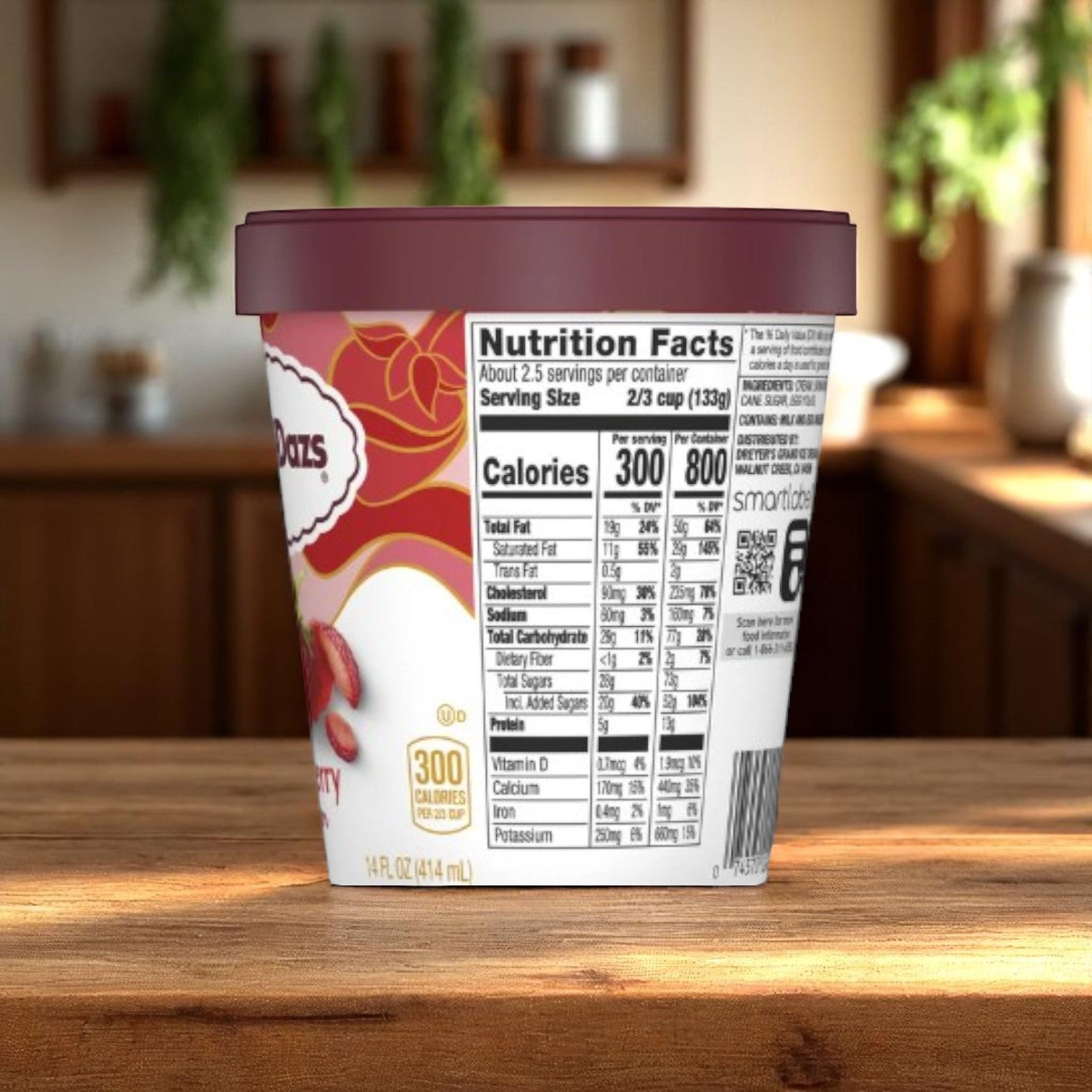 A 14 oz container of Haagan-Dazs Strawberry Ice Cream, a gluten-free premium dessert with 300 calories per serving, sits on a kitchen table with its nutrition label visible.