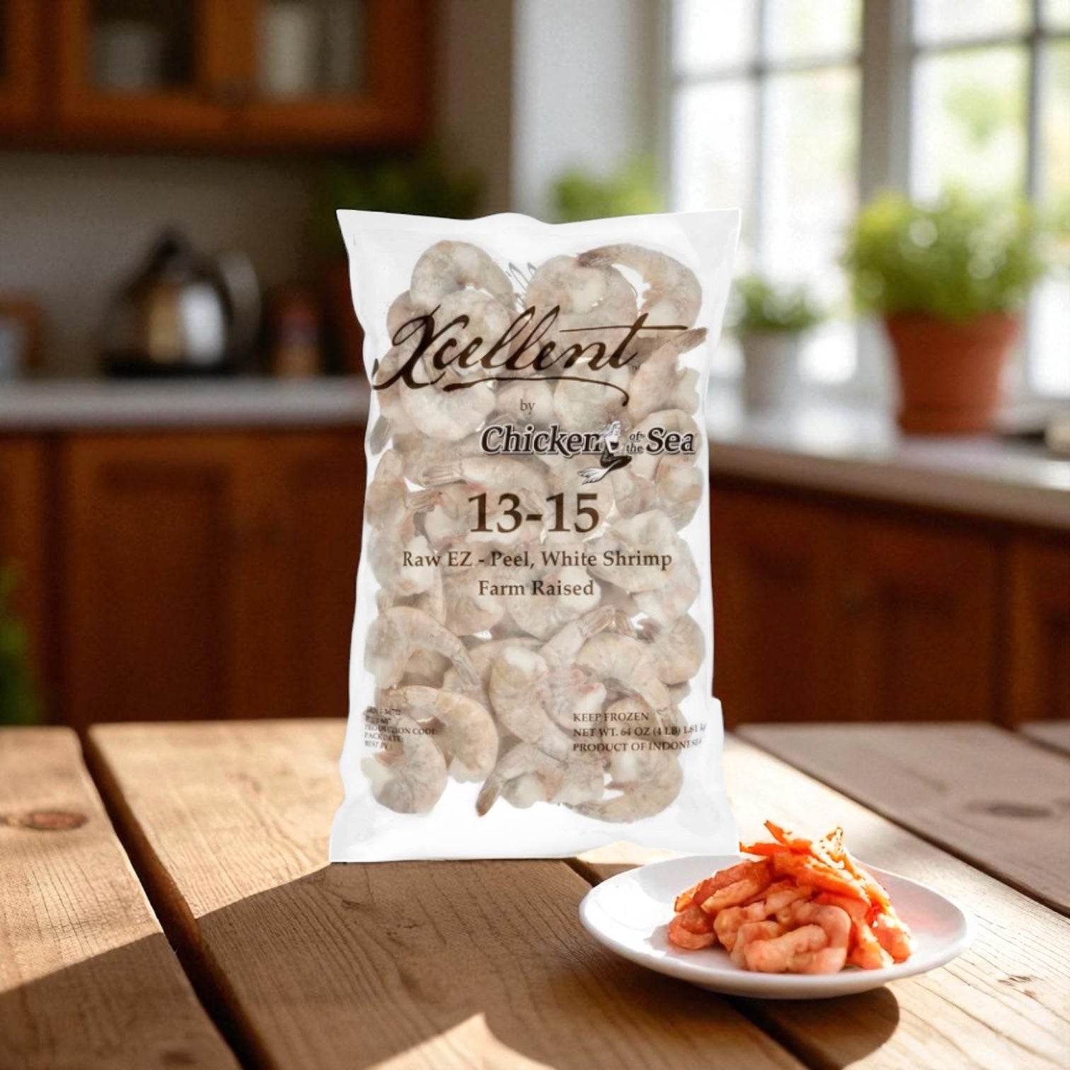 A bag of Kirkland Signature Farmed U-15 White Shrimp, 4 lbs, sits on a kitchen counter with a plate of cooked shrimp and garnish displayed in the foreground.
