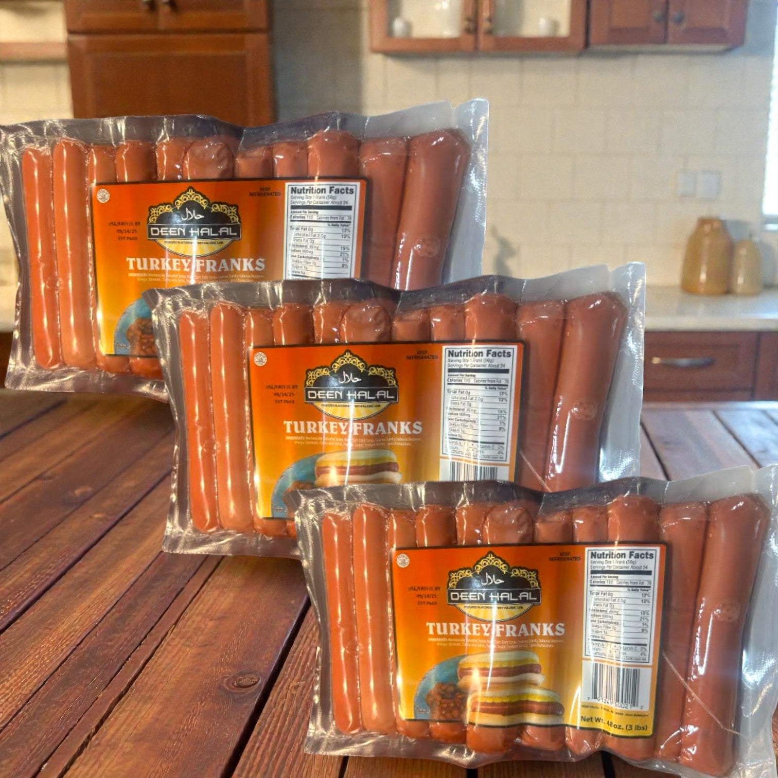 Deen Halal Turkey Franks – 3 Pack Bundle (72 franks, 9 lbs) is displayed on a wooden table, highlighting this convenient offering from Deen Halal in a cozy kitchen setting.