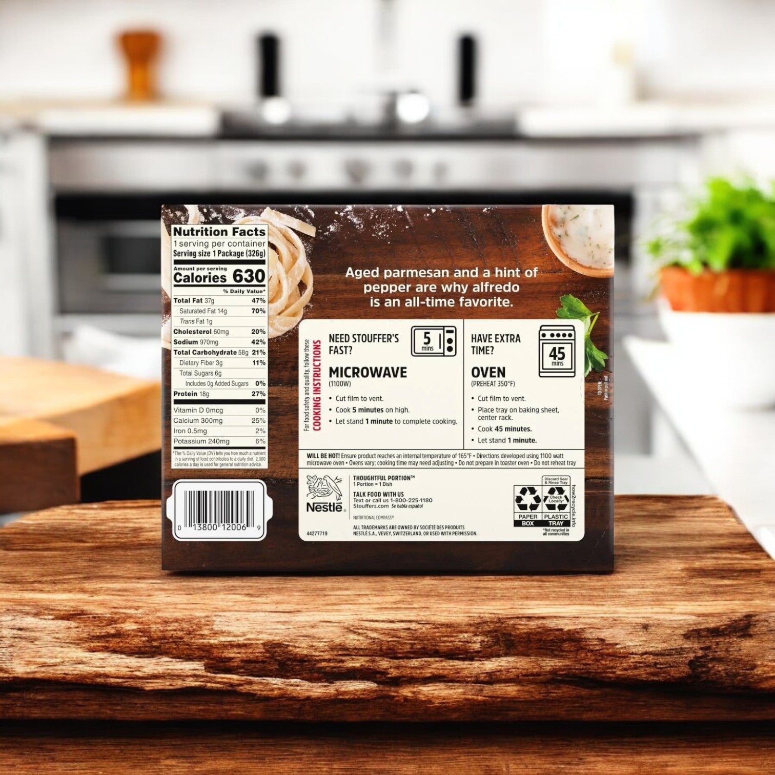 A box of Stouffer's Fettuccini Alfredo, 11.5 oz., rests on a kitchen counter with nutrition facts and cooking instructions clearly visible on the back, promising an authentic taste of Italian cuisine.