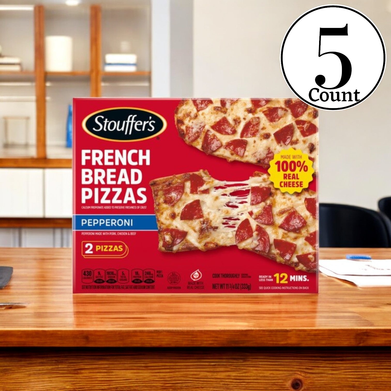 A box from the five-pack of Stouffer's Pepperoni French Bread Frozen Pizza rests on a wooden counter. The packaging highlights crispy French bread layered with 100% real cheese, displaying two delicious pizzas and offering a convenient 12-minute cook time for this tasty frozen option.