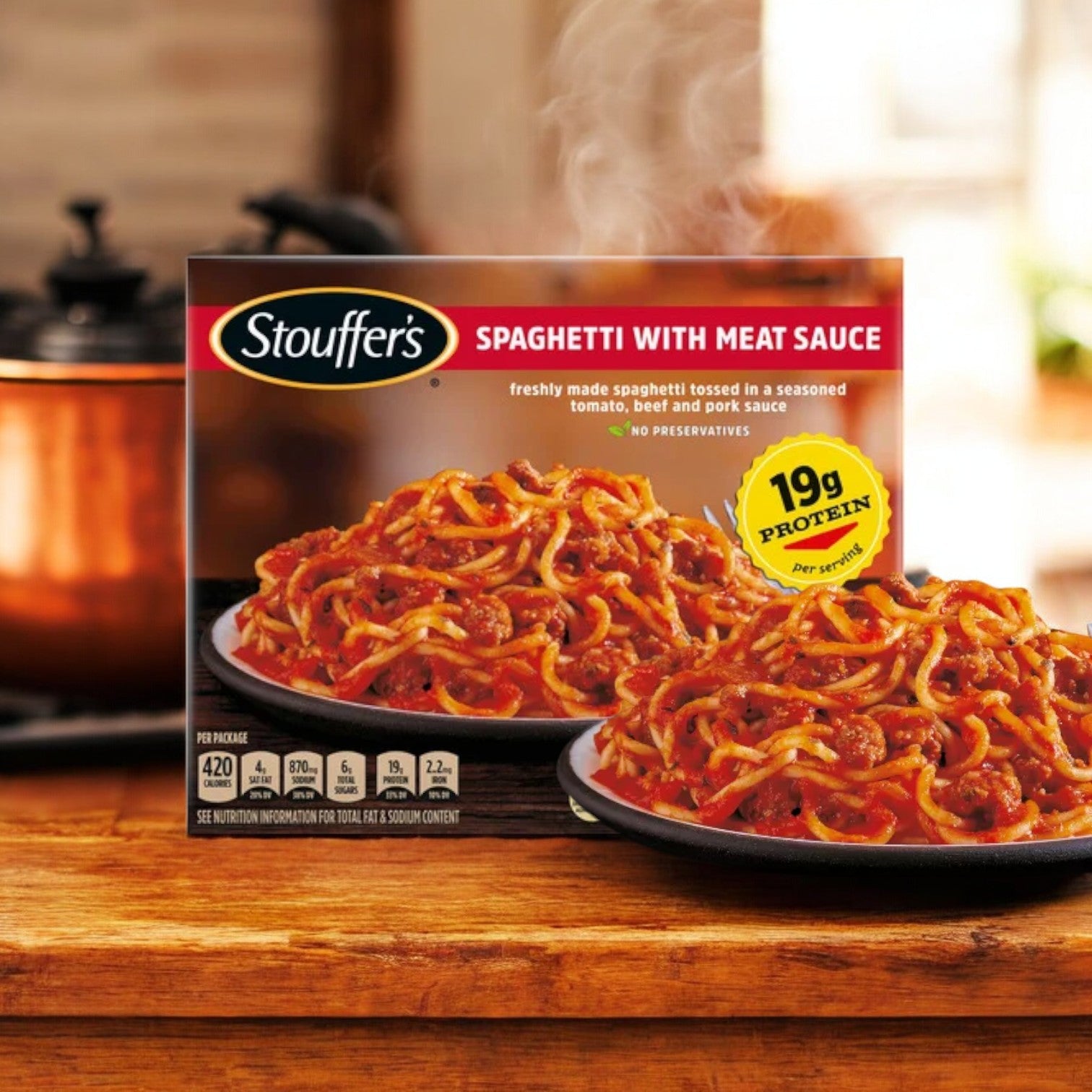 The Stouffer's Bundle! box is displayed, featuring a comforting assortment including Stouffer's Classics Spaghetti with Meat Sauce, Roast Turkey, and Classics Fettuccini Alfredo. The text highlights 19g of protein per serving for the spaghetti and no preservatives in any of the meals, making it an ideal convenient option for busy nights.