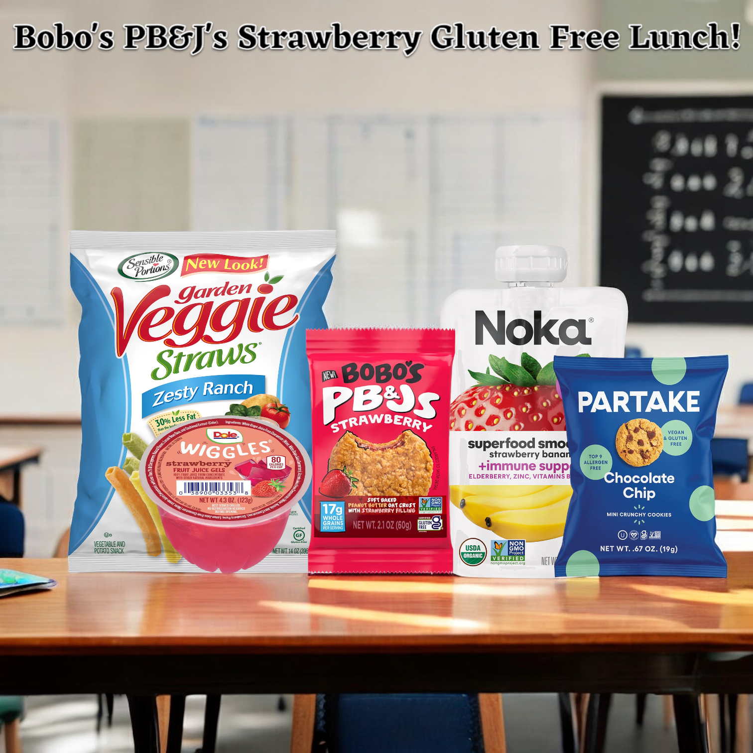 A display of snack products including Garden Veggie Straws, Welch's fruit snacks, Bobo's Strawberry PB&J's bar, Noka smoothie, and Partake cookies on a classroom desk. Text above reads "Easy Lunches Bobo's Strawberry Gluten Free Lunch! 1 Veggie Straw Zesty Ranch Bag, 1 Wiggles Strawberry Gel, 1 Bobo's Strawberry PB&J's bar.