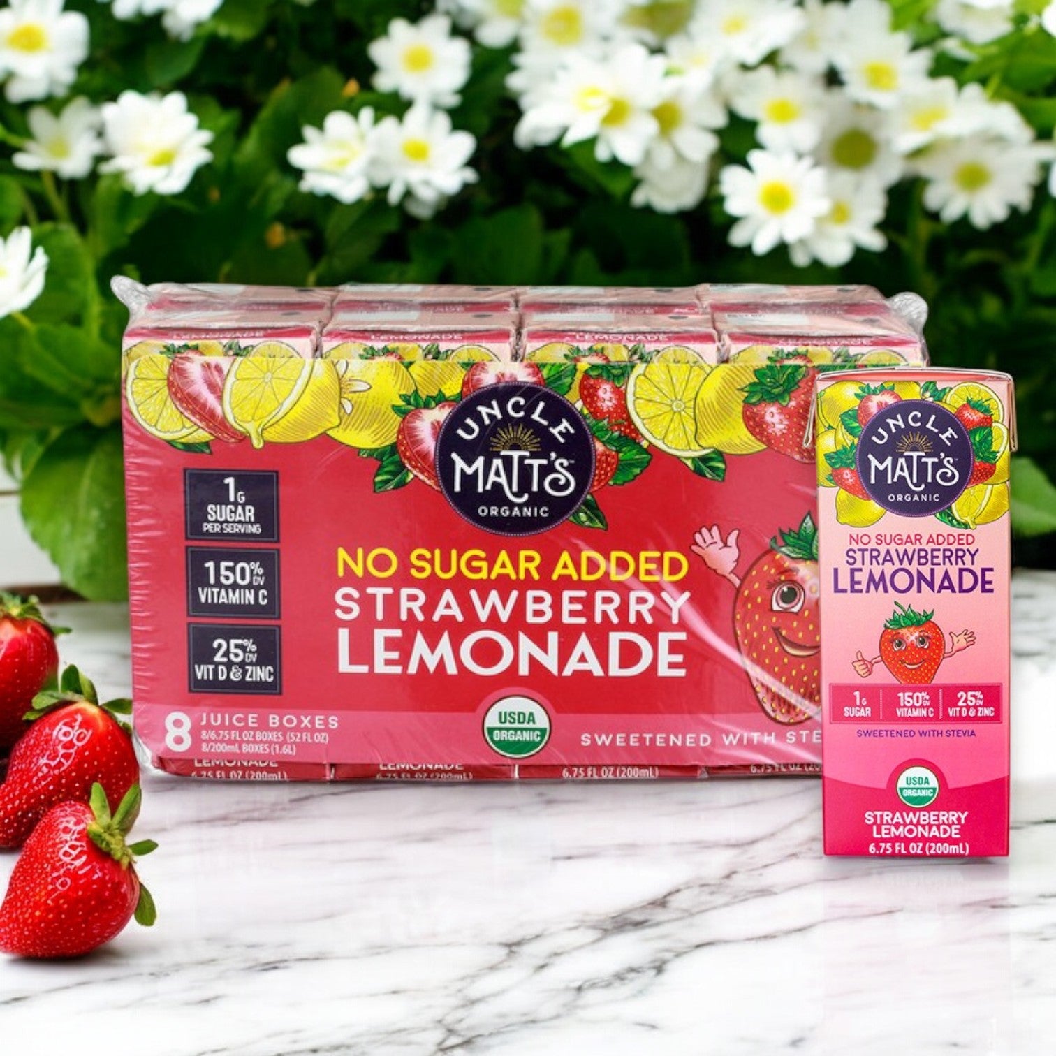 Uncle Matt's Organic No Sugar Added Strawberry Lemonade Juice Boxes (6.75 fl oz, 8-Pack) feature a floral and strawberry design, offering refreshing flavors and immune support.