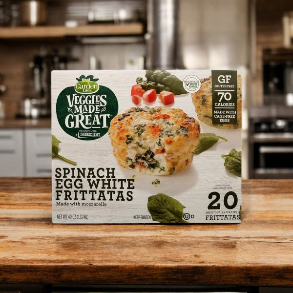 A pack of Garden Lites Vegetarian Spinach & Egg White Frittatas from the brand Veggies Made Great is sitting on a kitchen counter. The packaging highlights that they are gluten-free, contain 70 calories each, are made with mozzarella, and include 20 individually wrapped vegetarian frittatas. Indulge in this protein-packed breakfast for a low-calorie meal.