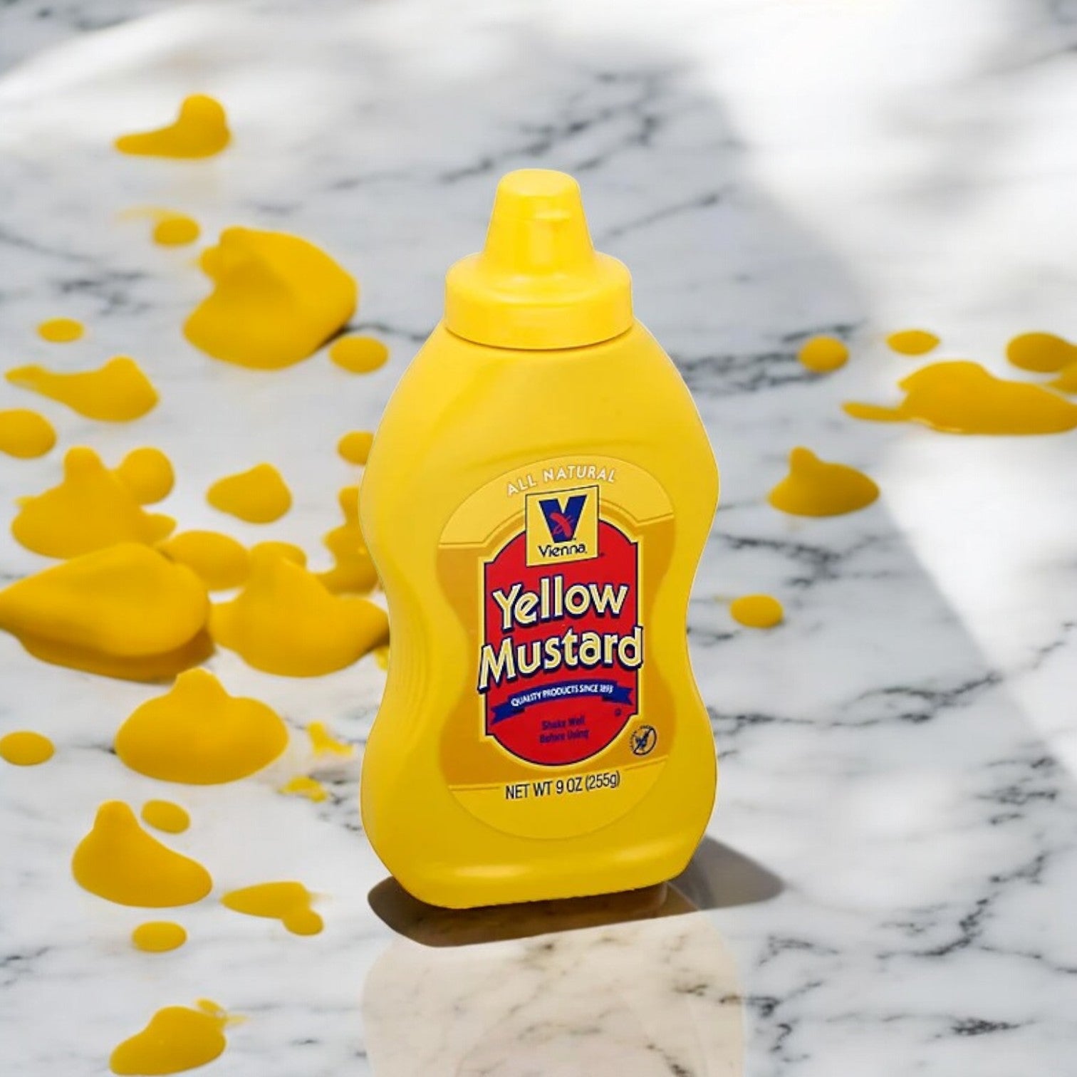 A Vienna Beef Yellow Mustard 9 oz. bottle rests on a marble surface, surrounded by mustard splatters, evoking the ideal Chicago-style hot dog topping.