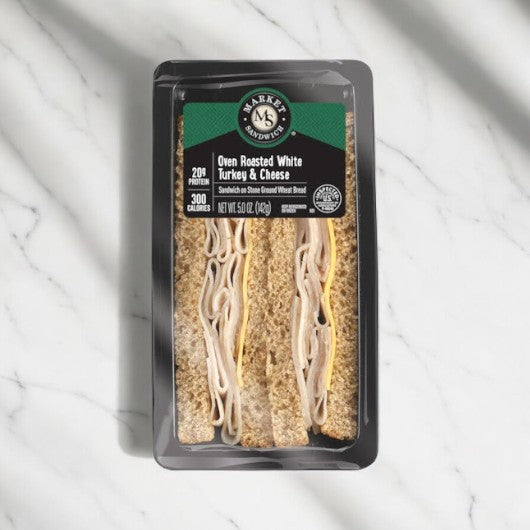 Oven Roasted Turkey & Cheese Sandwich Wedge, 5.0 oz, featuring nutritional information and E.A. Sween branding.