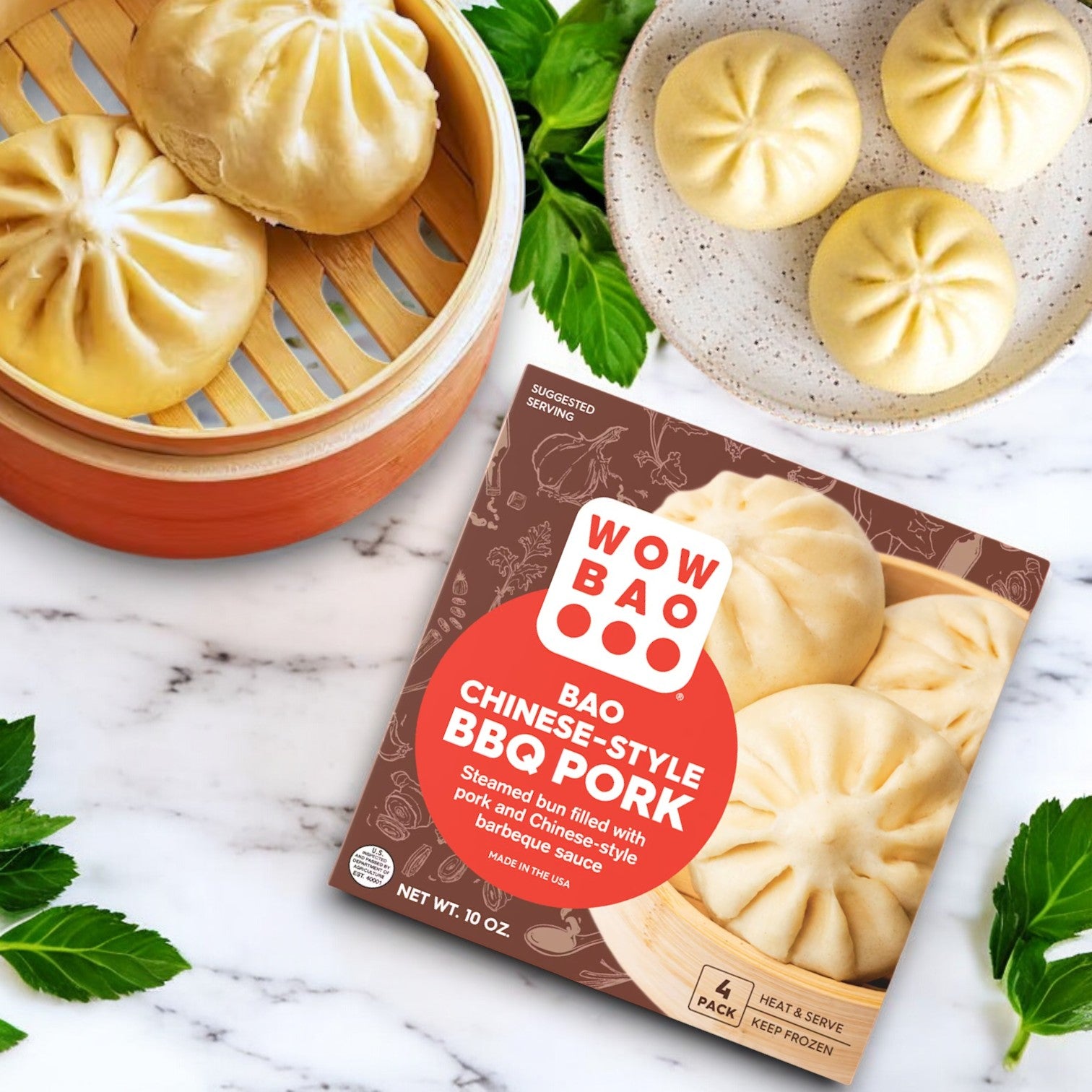 A Wow Bao 3 Pack Combo! of Chinese-style BBQ pork buns rests on a marble surface, accompanied by a bamboo steamer and three enticing buns on a plate.