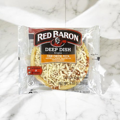 A packaged Red Baron Frozen Pizza Deep Dish Singles - 12 Count on a marble surface, perfect for a quick and satisfying meal.