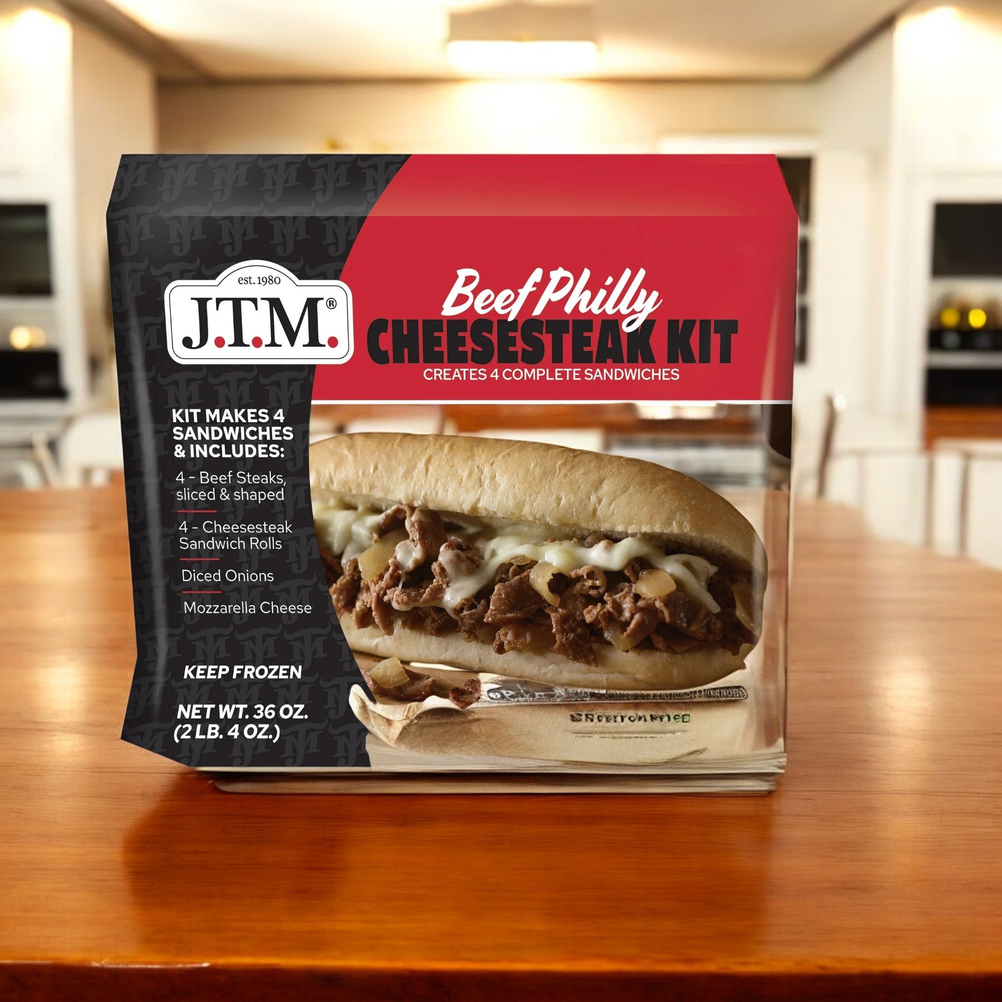 A box of Walmart's J.T.M. Beef Philly Cheese Steak Kit - 1 Count is on a wooden kitchen table, featuring an image of a classic Philly cheesesteak sandwich on the front, ensuring quick prep for delicious results.