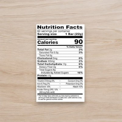 Feature the Nutrition Facts label for Kellogg's Rice Krispies Treats, 0.78 oz (1 Count), conveniently placed on a wooden surface. Each bar (22g) per serving contains 90 calories, 2g total fat, 0mg cholesterol, 106mg sodium, 17g total carbohydrates, and less than 1g protein. Made with real ingredients for a classic taste in convenient packaging by Kellogg's.