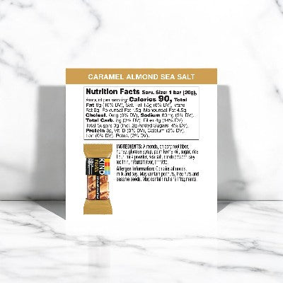 The packaging of KIND Minis Caramel Almond & Sea Salt - 10 Count highlights the nutrition facts and ingredients list on a clean white background, making it an ideal healthy snack choice.