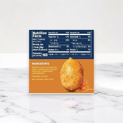 On a marble surface, a food package displays nutrition facts and ingredients alongside an image of a golden-brown snack with text that reads "My continual true mitten," highlighting Planters Honey Roasted Peanuts - 5 bags, 1.5 oz each.