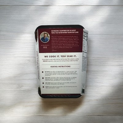 A packaged food container with heating instructions and nutritional information printed on the back. The lid displays a photograph of Kevin's Mongolian Beef and a brief description of this gluten-free product from Kevin's, 32 oz- 1 Count.