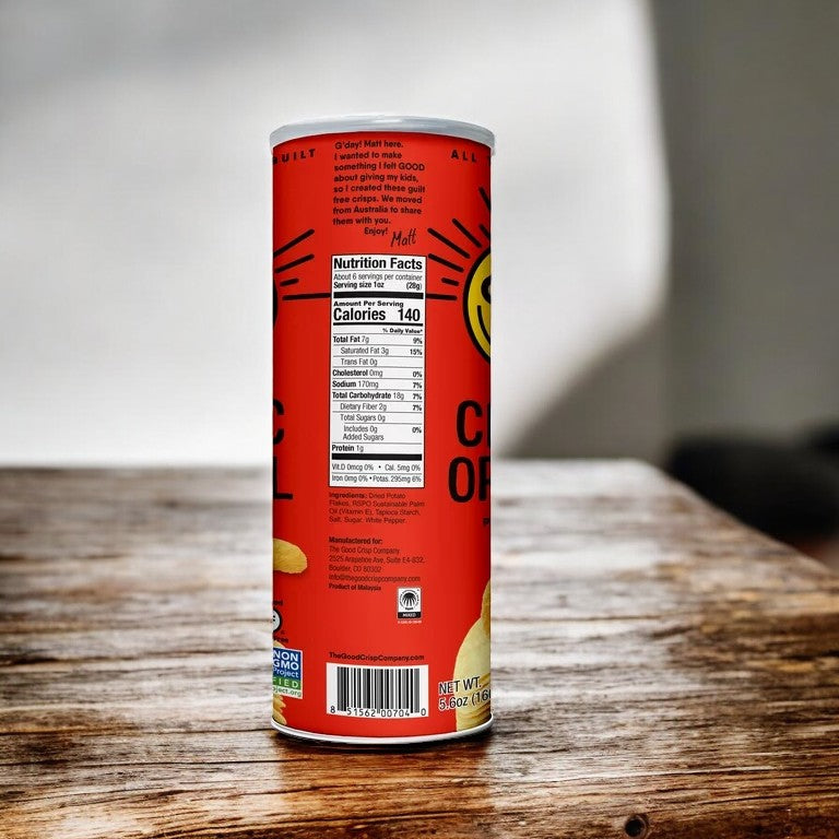 A 5.6 oz can of The Good Crisp Company Gluten Free Original Snack Chips with a red label and nutritional facts displayed on a wooden surface.