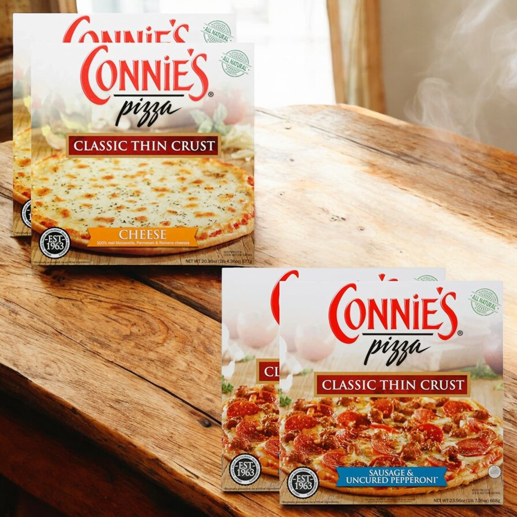 Two boxes from the Easy Lunches collection rest on a wooden table, featuring Connie's Pizza Bundle! One box offers Sausage & Uncured Pepperoni Pizzas while the other showcases Cheese Classic Thin Crust Pizzas – four in total, perfect for your next pizza party pack.