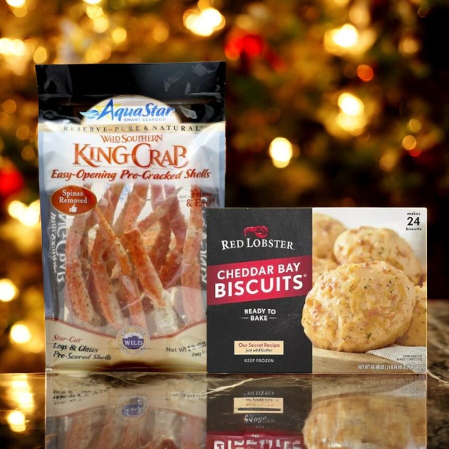 Place a package of Aqua Star King Crabs & Cheddar Bay Biscuits Combo by Easy Lunches against a blurred festive background to create the perfect Seafood Feast.