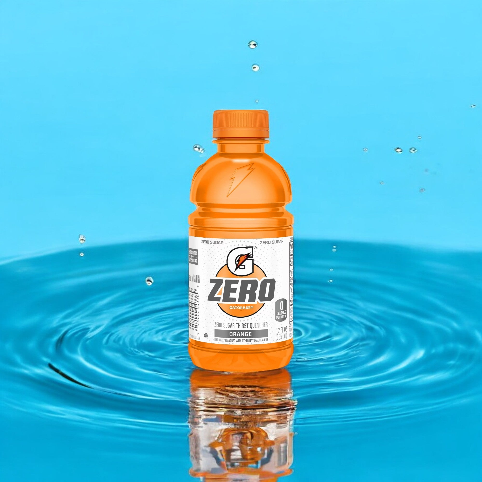 A mini 12 oz bottle of Gatorade Zero Sugar Thirst Quencher, Orange Sports Drink stands upright on a blue background, surrounded by water ripples and droplets, embodying the perfect blend of hydration and recovery.