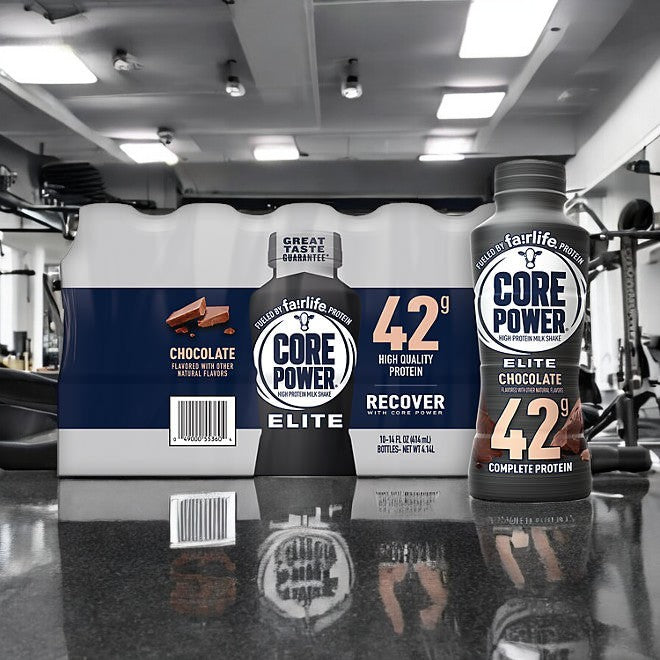 On a gym counter sits a bottle of FairLife's Fairlife Core Power Elite 42g Protein Shake in chocolate flavor, offering 42 grams of protein—ideal for muscle recovery.