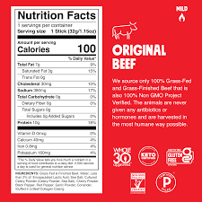 The 24-pack of Original Beef Chomps sticks from Chomps, presented in a red package displaying nutrition facts, highlights 100 calories per serving, high protein content, and various certifications such as Whole30 Approved and Keto Certified. The text also emphasizes the use of grass-fed, non-GMO beef.