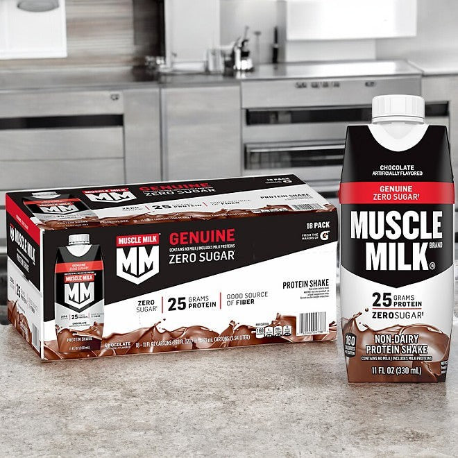 Muscle Milk Protein Shake, Chocolate, 11 fl oz, 18-pack, sits on a kitchen counter as the perfect muscle recovery aid. With zero sugar and 25g of protein, it offers an ideal nutrition boost.