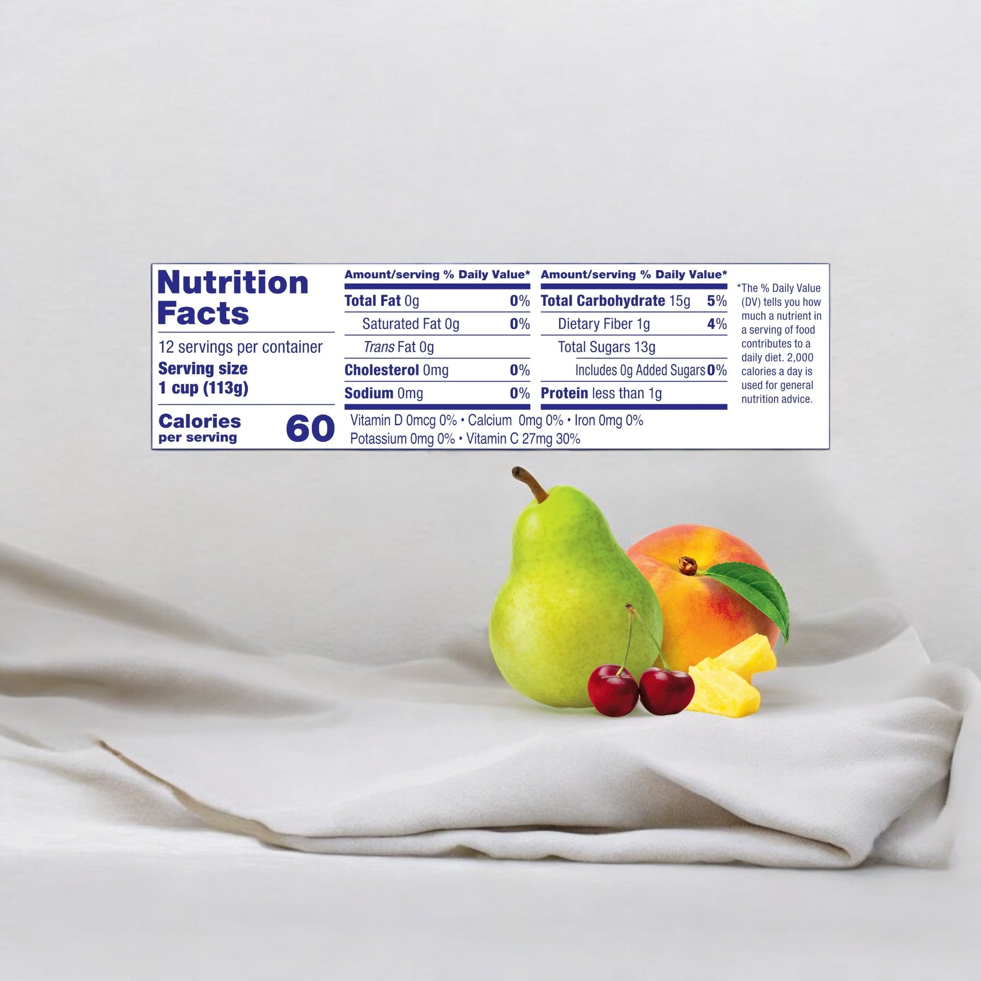 A close-up of a nutrition facts label for Dole Fruit Bowls Cherry Mixed Fruit in 100% Fruit Juice with 60 calories per serving and 12 servings per container, placed next to various fruits including a pear, peach, and banana slices. The shelf-stable packaging ensures freshness and provides a good source of Vitamin C.