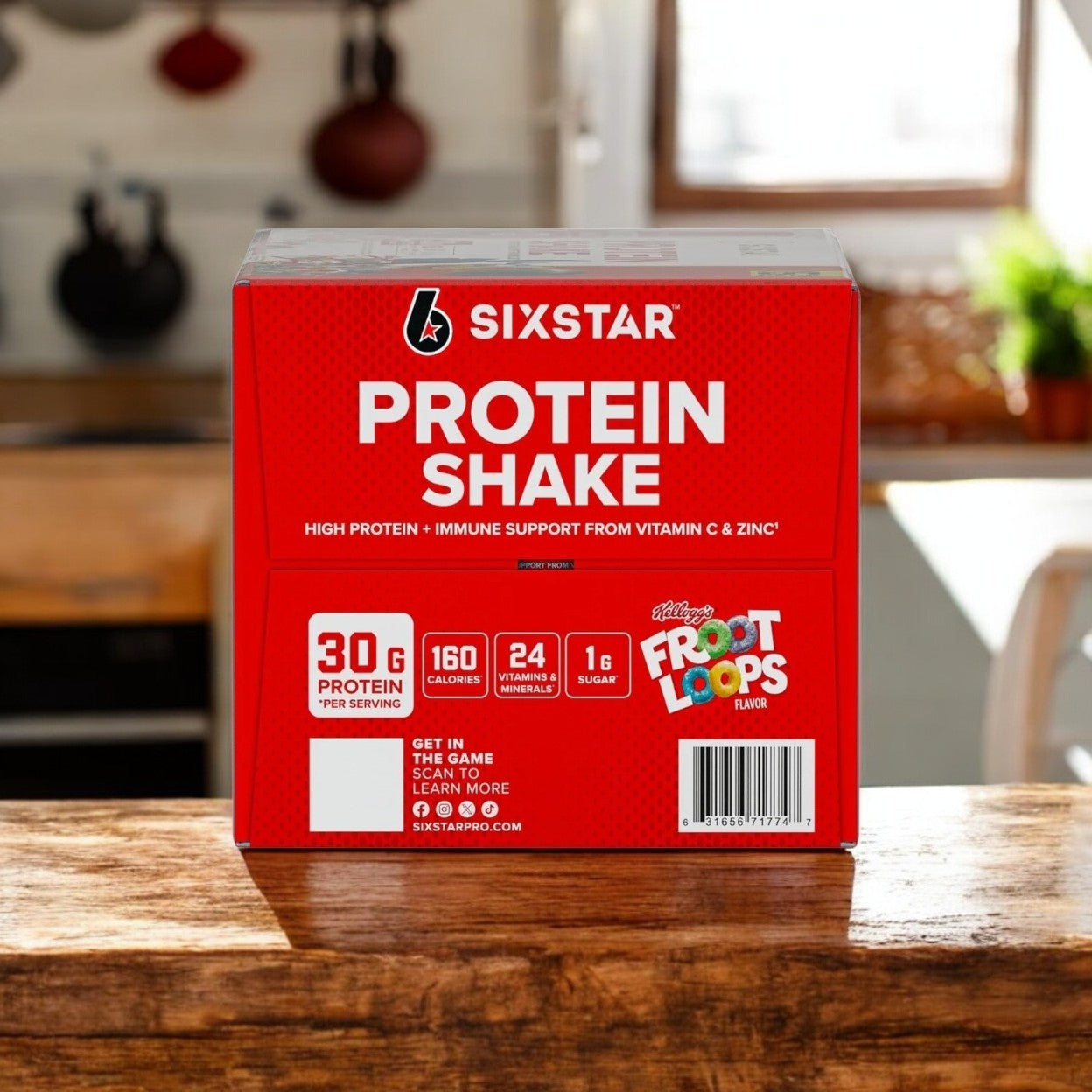 A vibrant red box of Six Star Kellogg's Froot Loops Protein Shake offers 30g of quality whey protein per serving, enriched with essential vitamins & minerals, displayed on a cozy kitchen’s warm wooden surface.