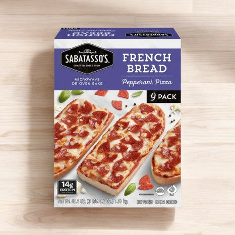 A box from Easy Lunches containing Sabatasso's Pizza Bundle! shows three pieces of French Bread Pepperoni Pizza, complete with pepperoni and cheese. The bundle includes 9 of these French Bread Pepperoni Pizzas as part of a 12-pack assortment that also features 6 Four-Cheese Pizzas. Details on the packaging highlight protein content and cooking instructions, all spread across two boxes for a total of 21 items.