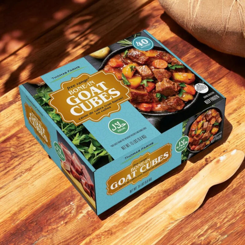 A box of Thomas Farms 3-Pack Halal Meat Bundle sits on a wooden surface next to a wooden spoon.