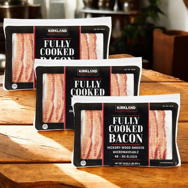 Three packs of Easy Lunches Kirkland Signature Fully-Cooked Bacon, Hickory Wood Smoked, 1 lb each (3 lbs total), are displayed. Each pack contains 48-50 microwavable slices.