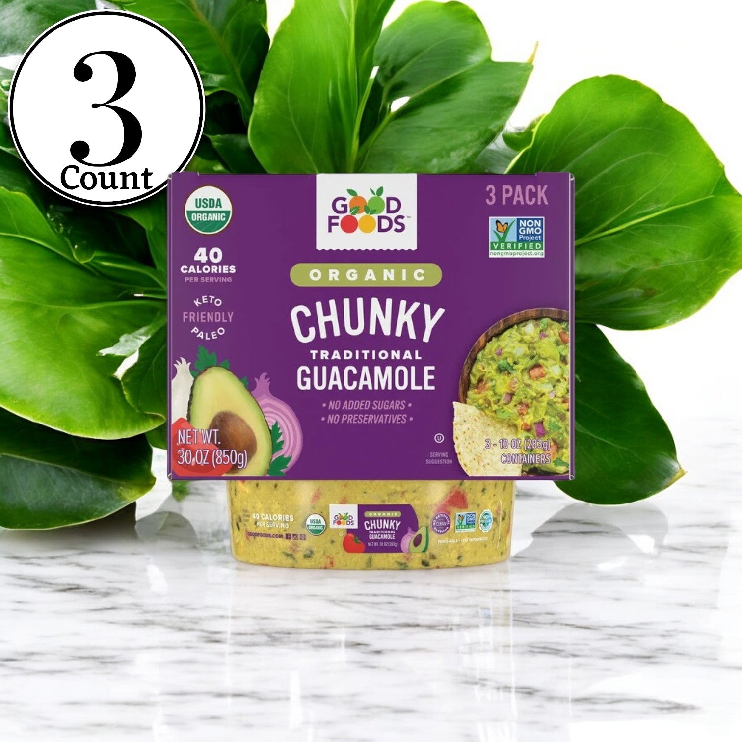 A box of Good Foods Organic Chunky Guacamole, 10 oz, 3 Count - 3 Pack is set against lush green leaves. Highlighted text emphasizes its USDA Organic certification, only 40 calories per serving, and keto-friendly nature, made with organic avocados and non-GMO ingredients.