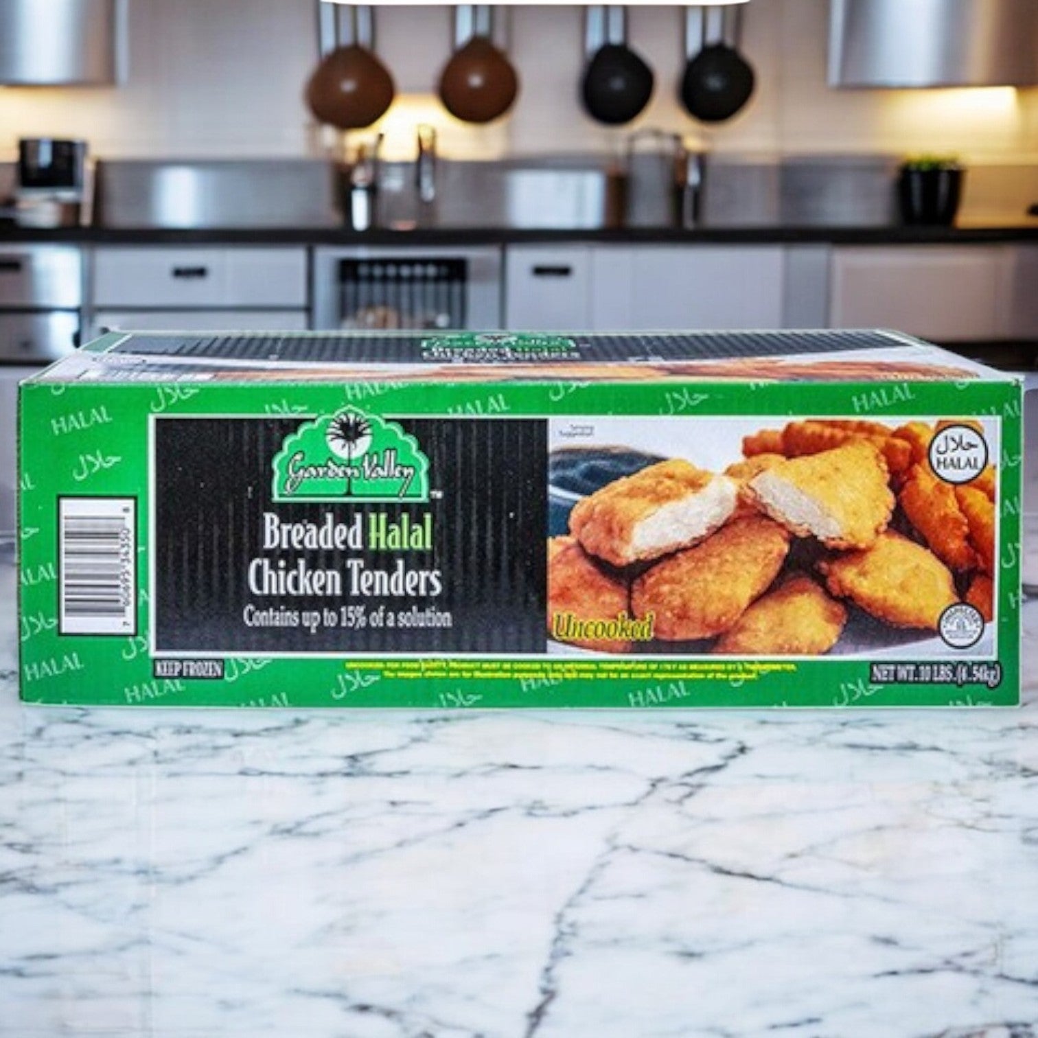 A box of Garden Valley Breaded Original Mild Halal Chicken Wings is on the kitchen counter. The packaging shows crispy cooked wings, noting "contains up to 15% of a solution" and "fully cooked.