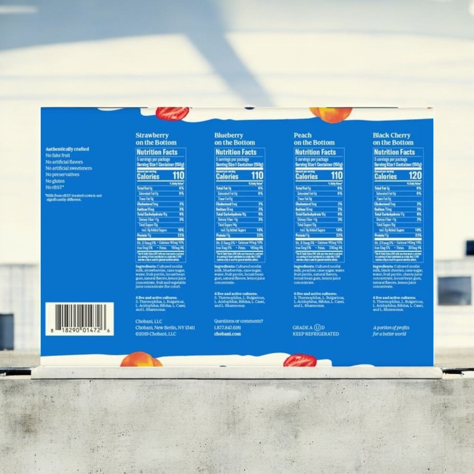 The back of the Chobani Greek Yogurt Variety Pack shows detailed nutrition facts for strawberry, blueberry, peach, and black cherry on a blue background, highlighting their high-protein content and no added sugar as a healthy choice.