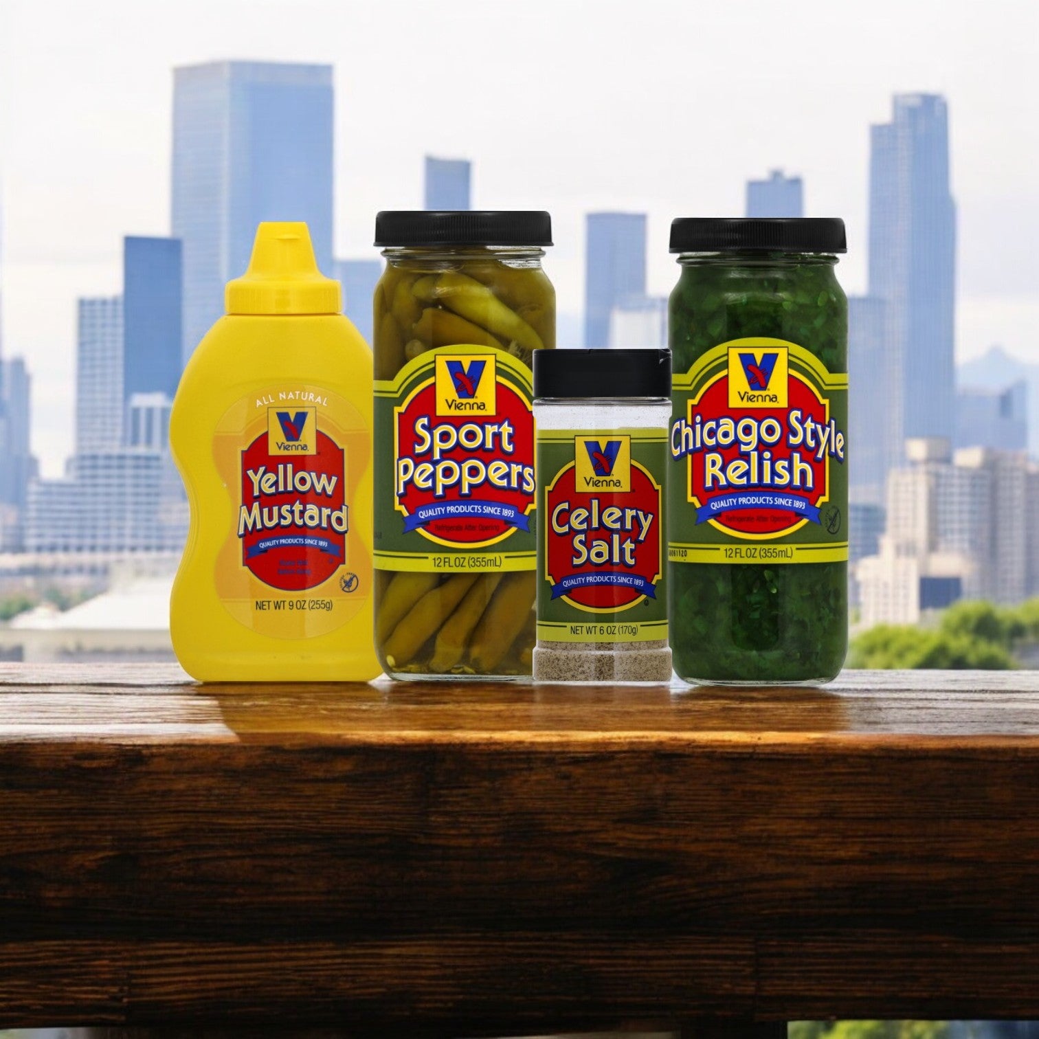 The Vienna Beef Condiment Kit is displayed on a wooden table with a city skyline, evoking the classic Chicago-style hot dog experience.