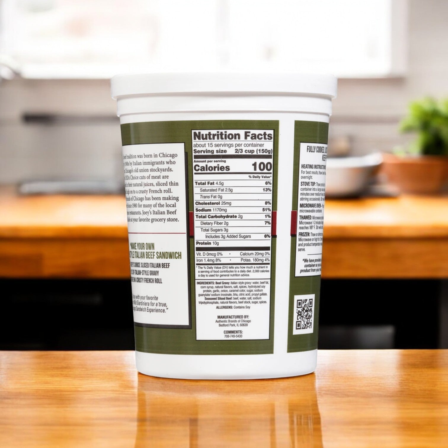 A container of Joey’s Sliced Beef with Gravy & Italian Seasoning by Easy Lunches, complete with nutrition facts and an ingredients label, elegantly sits on a wooden kitchen counter.