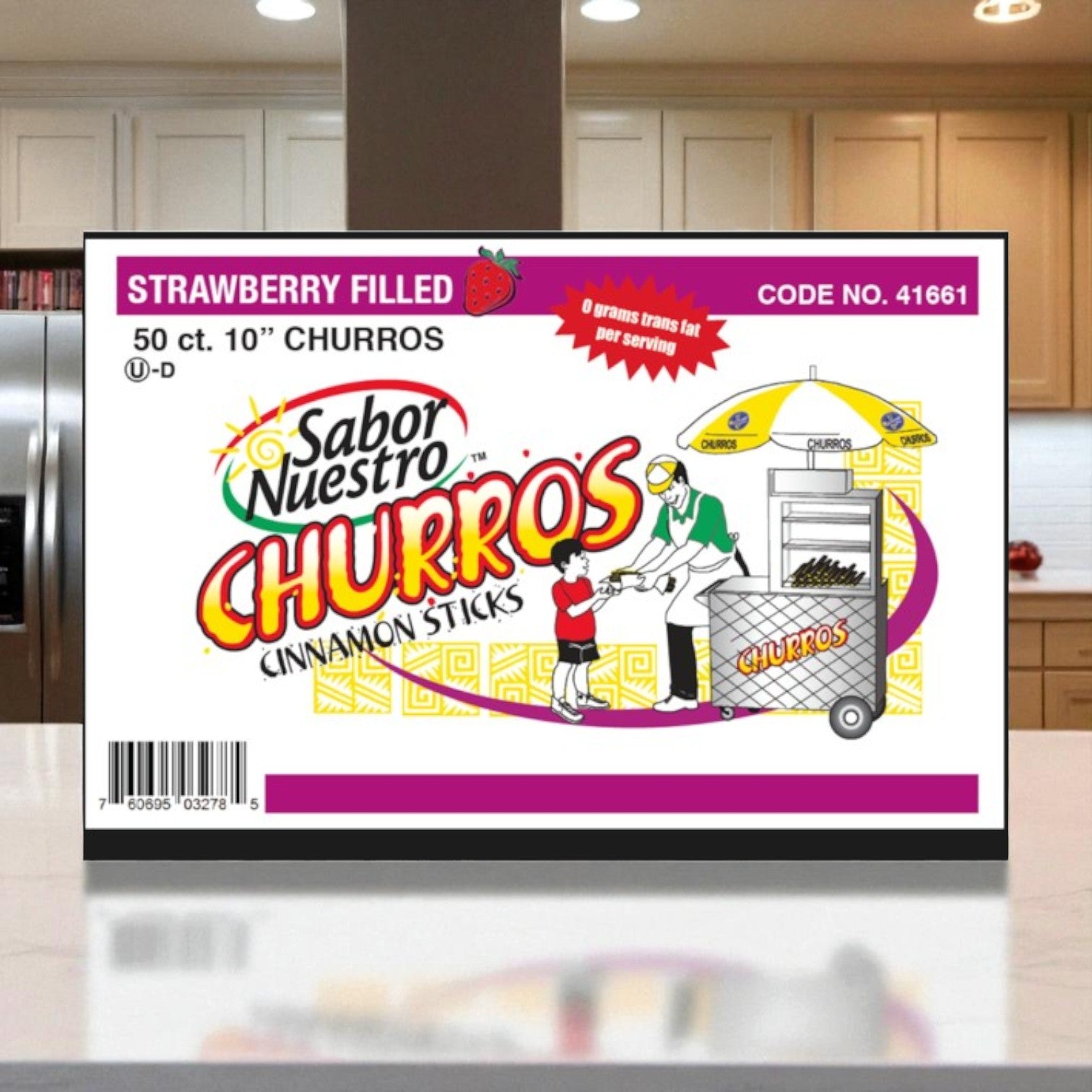 A box of Sabor Nuestro Strawberry Churros Cinnamon Sticks – 10" (50 ct) sits on the kitchen counter, featuring a churro cart illustration—perfect for enjoying delicious frozen strawberry churros at home.