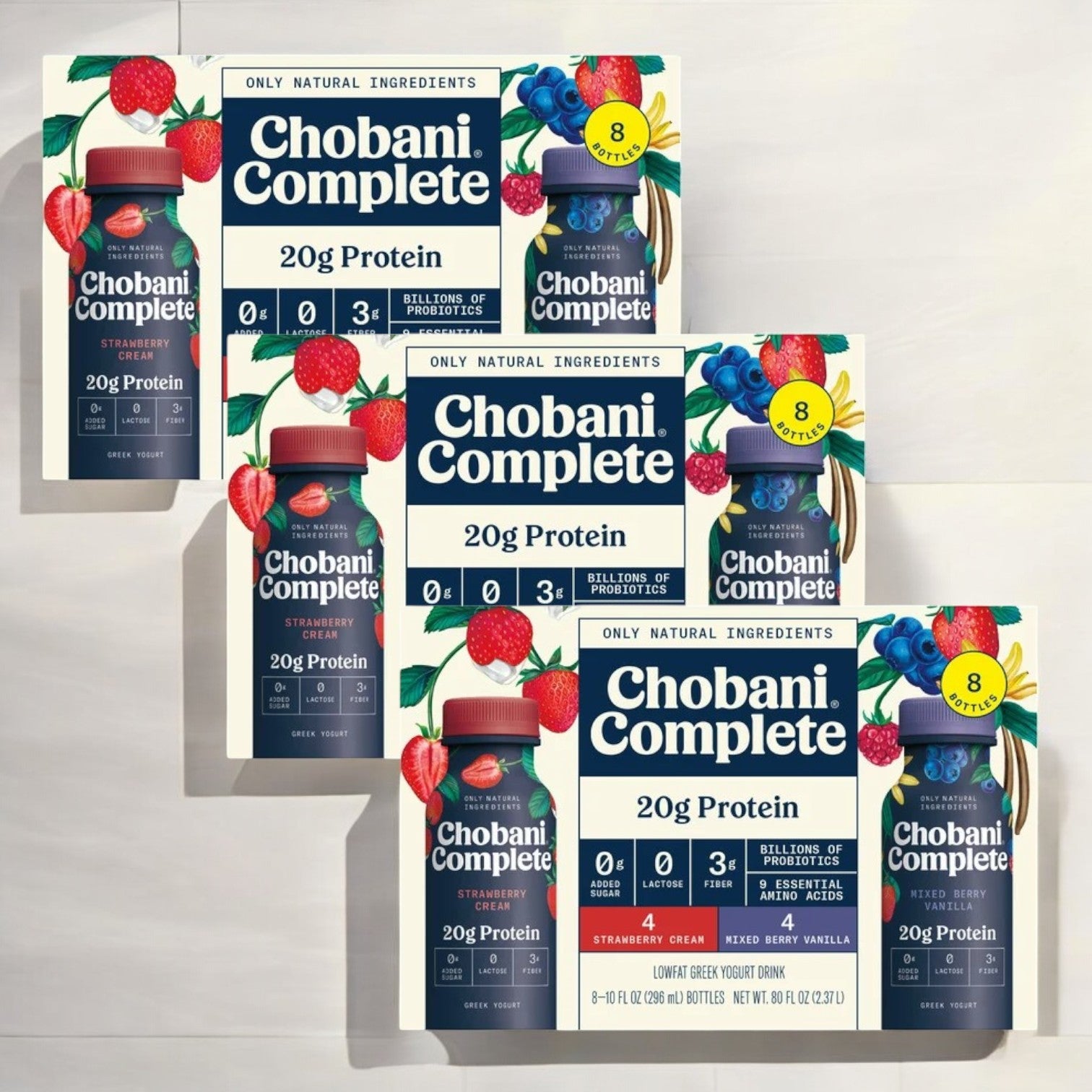 Boxes of Chobani Complete Protein Drink, each offering 20g protein and probiotics with no added sugar, are arranged on a light surface.