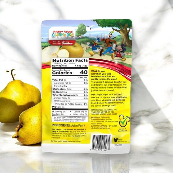 Back of a snack package featuring nutrition facts, ingredients, and Disney's Mickey Mouse Clubhouse branding. The background shows two yellow pears and a marble surface, highlighting the Brothers All Natural Disney Freeze-Dried Asian Pear Fruit Crisps .35 oz - 1 Count—a delightful and healthy freeze-dried Asian pear snack perfect for children.